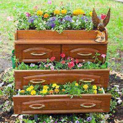 Multi-tiered flower bed from an old chest of drawers