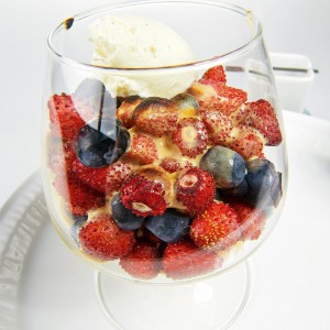 Nut sabayon with berries and ice cream