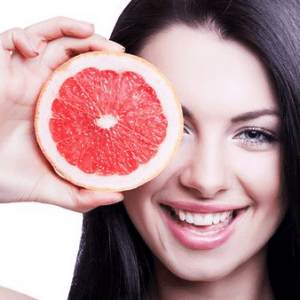 Girl with grapefruit