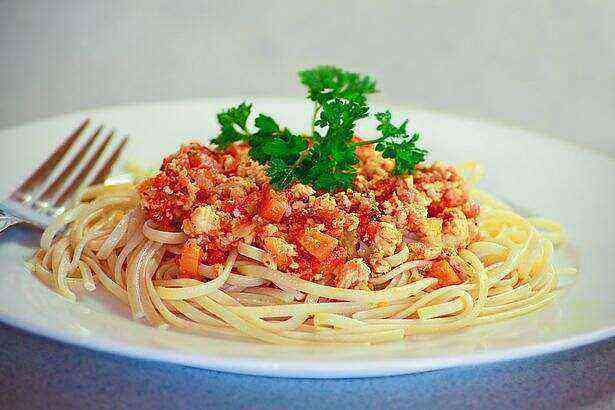 Vegetables and minced meat are often added to spaghetti.