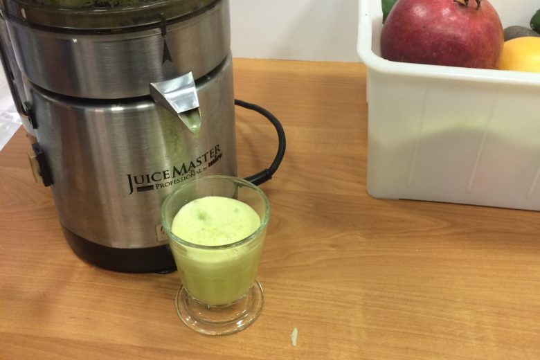 Cabbage juice is prepared in a juicer