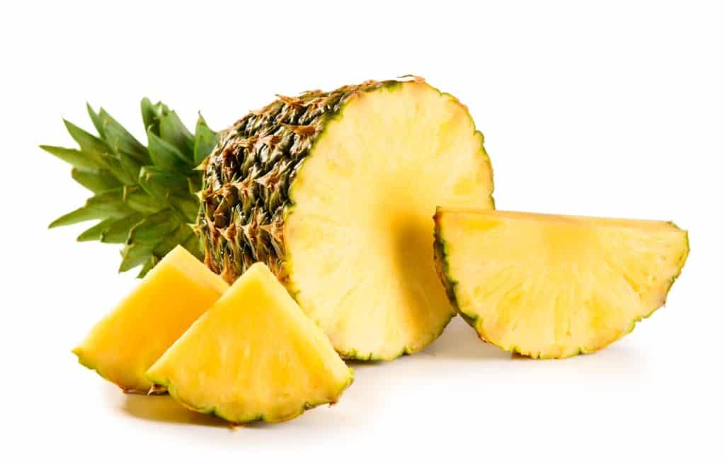 Pineapple cut in half and pieces