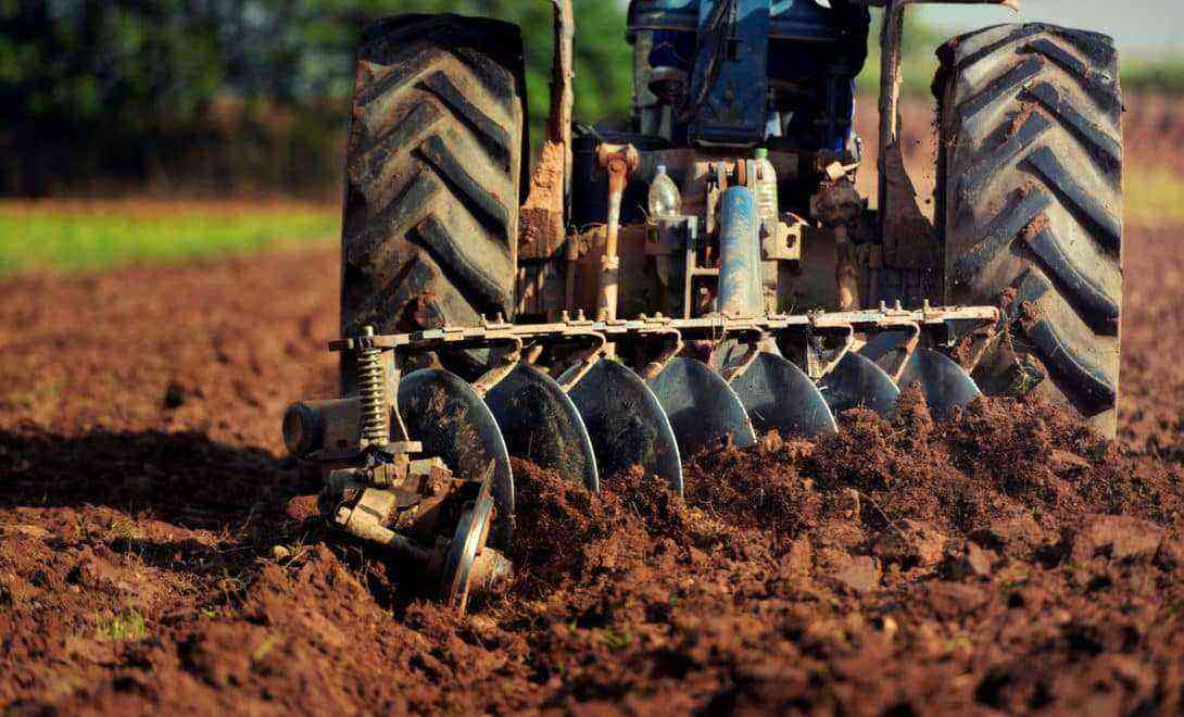 Smooth disc plow in soil tillage operation; one of the most used agricultural implements