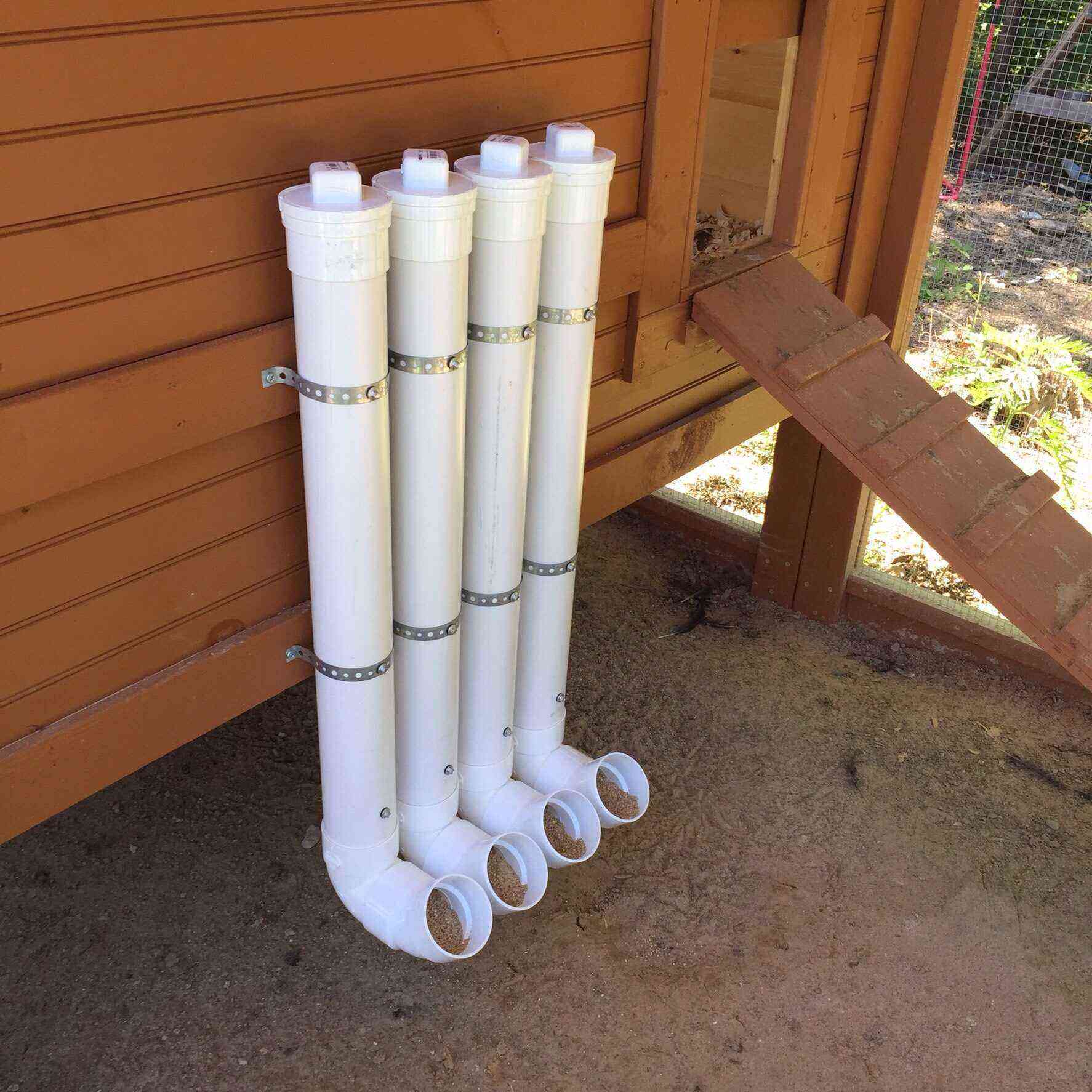 Chicken feeders made of plastic sewer pipes